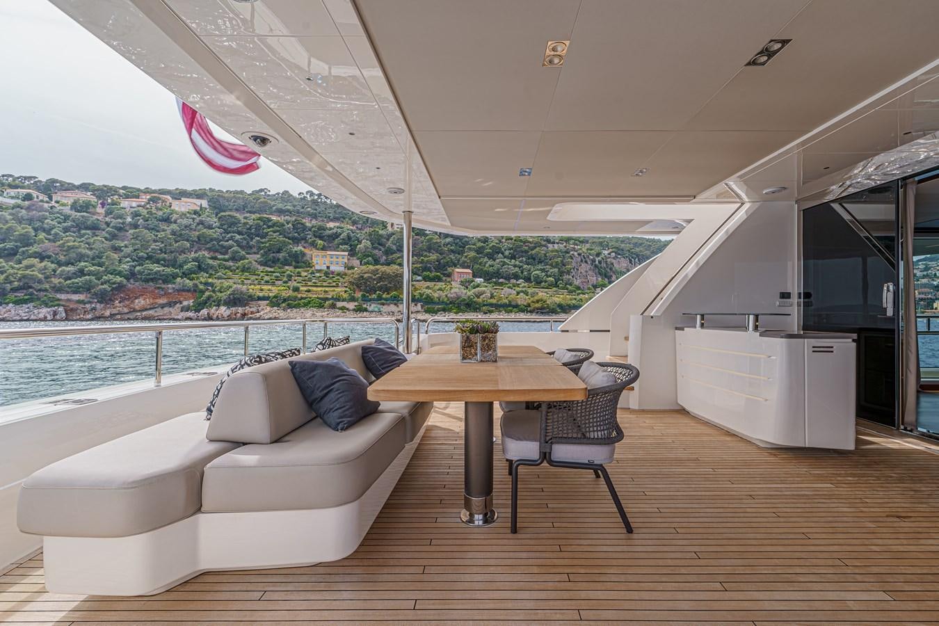 a living room with a couch and a table aboard AVALON Yacht for Sale
