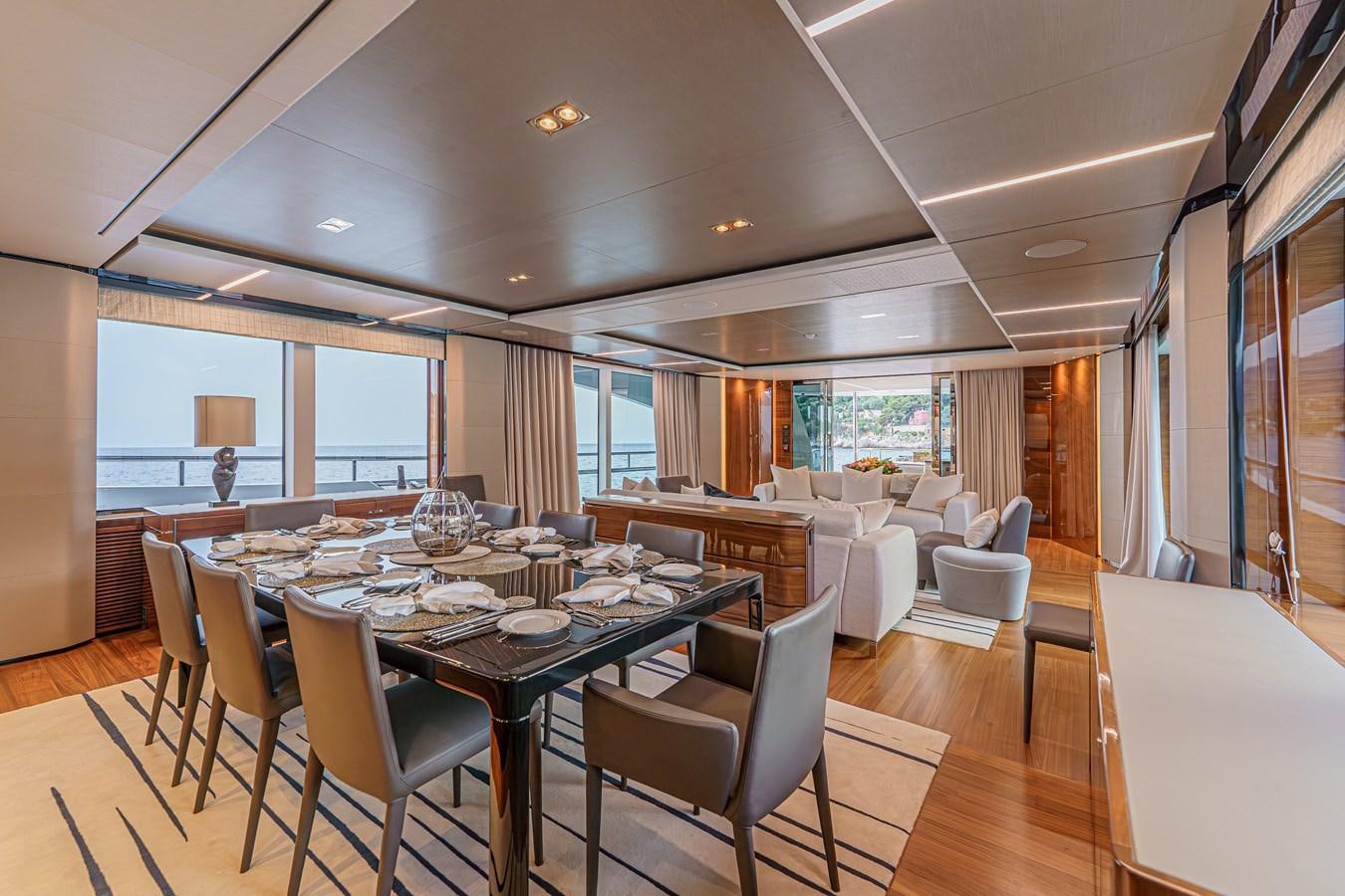 a large dining room with a large table and chairs aboard AVALON Yacht for Sale
