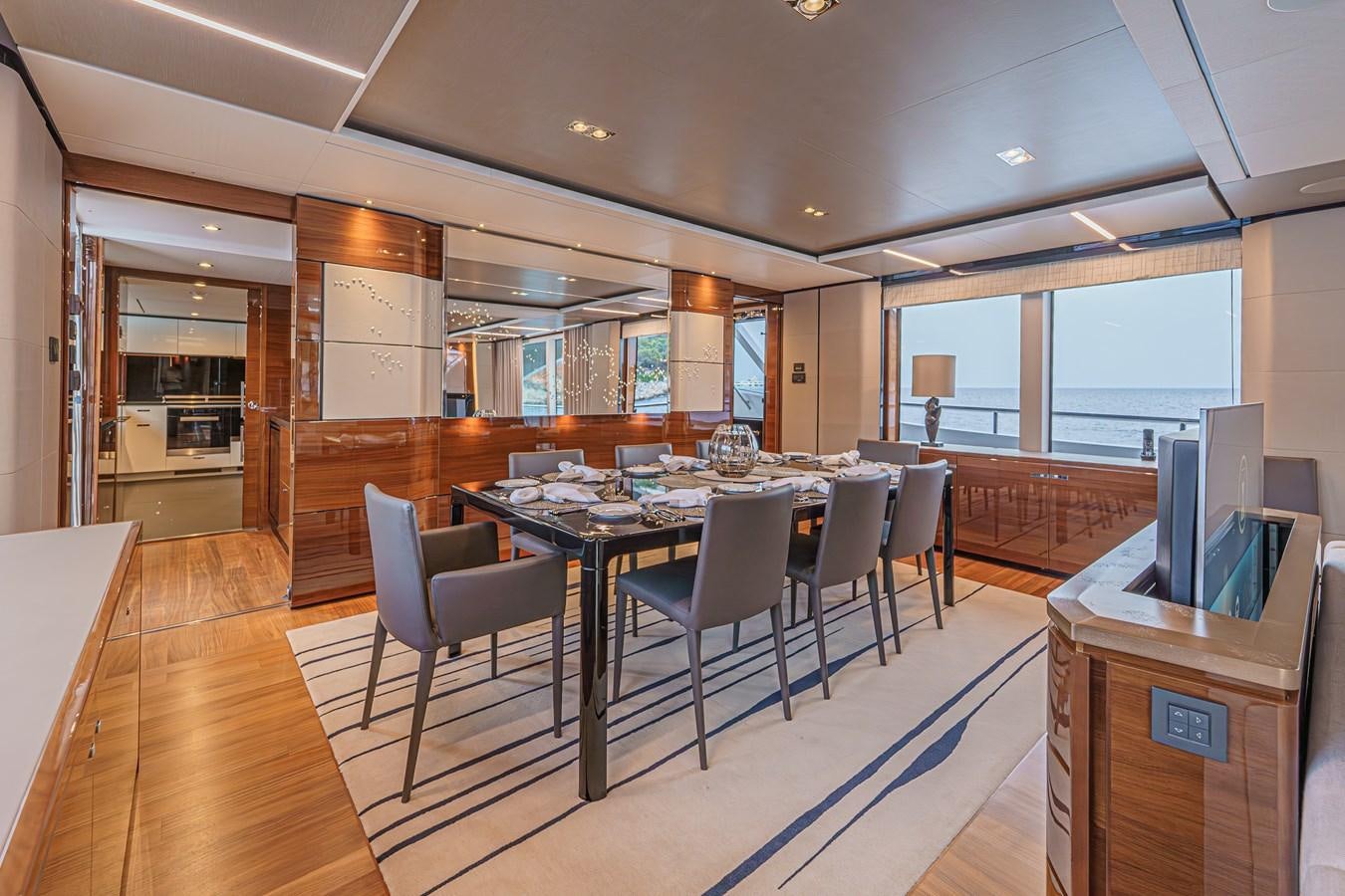 a large room with a table and chairs aboard AVALON Yacht for Sale