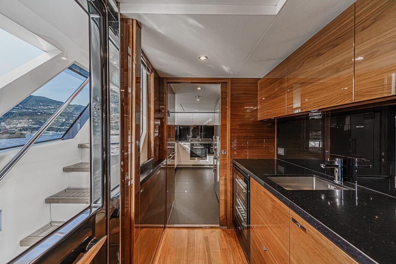 a kitchen with a large glass door aboard AVALON Yacht for Sale