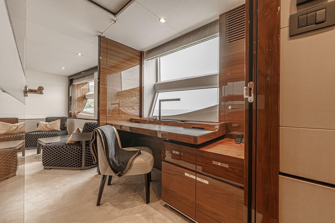 a room with a chair and a desk aboard AVALON Yacht for Sale