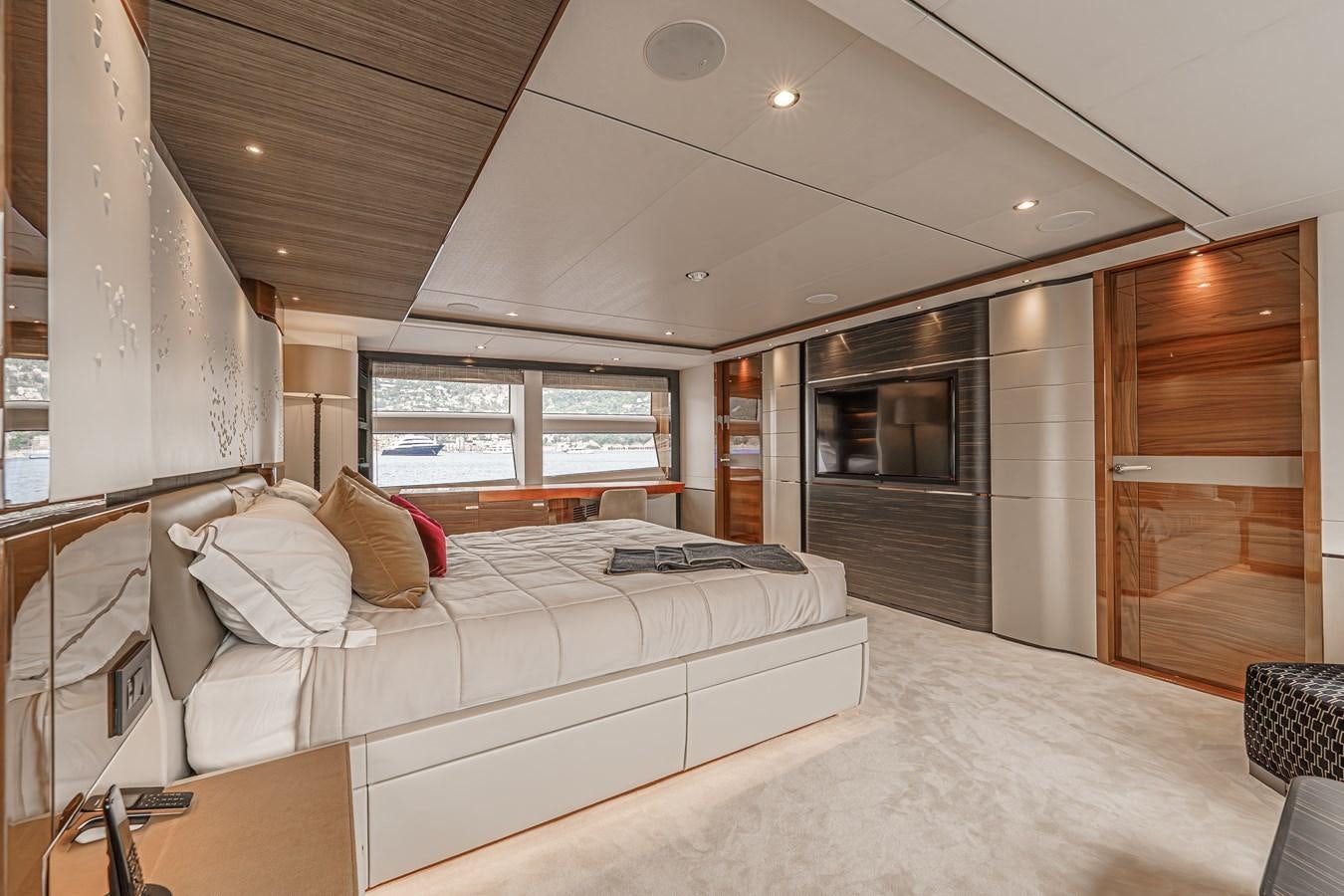 a large bedroom with a large bed aboard AVALON Yacht for Sale