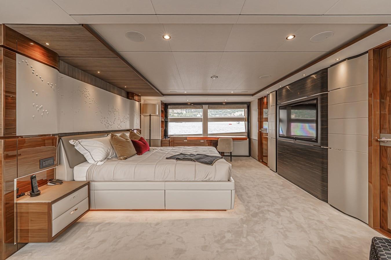 a large bedroom with a large bed aboard AVALON Yacht for Sale