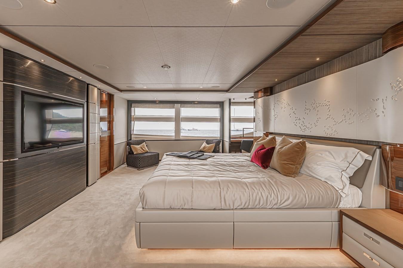 a bedroom with a bed and a tv aboard AVALON Yacht for Sale