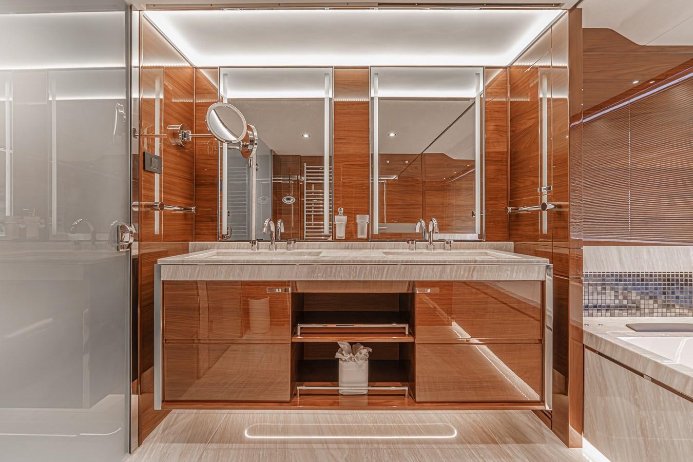 a bathroom with a large mirror aboard AVALON Yacht for Sale