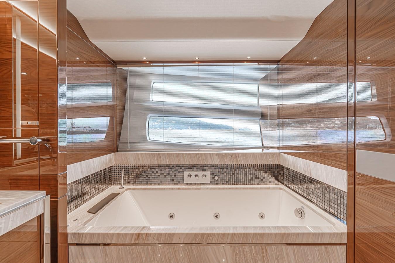 a bathroom with a tub aboard AVALON Yacht for Sale