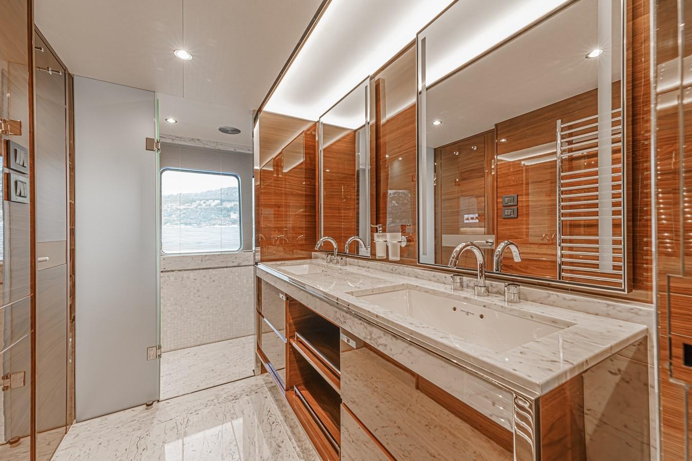 a bathroom with a large mirror aboard AVALON Yacht for Sale