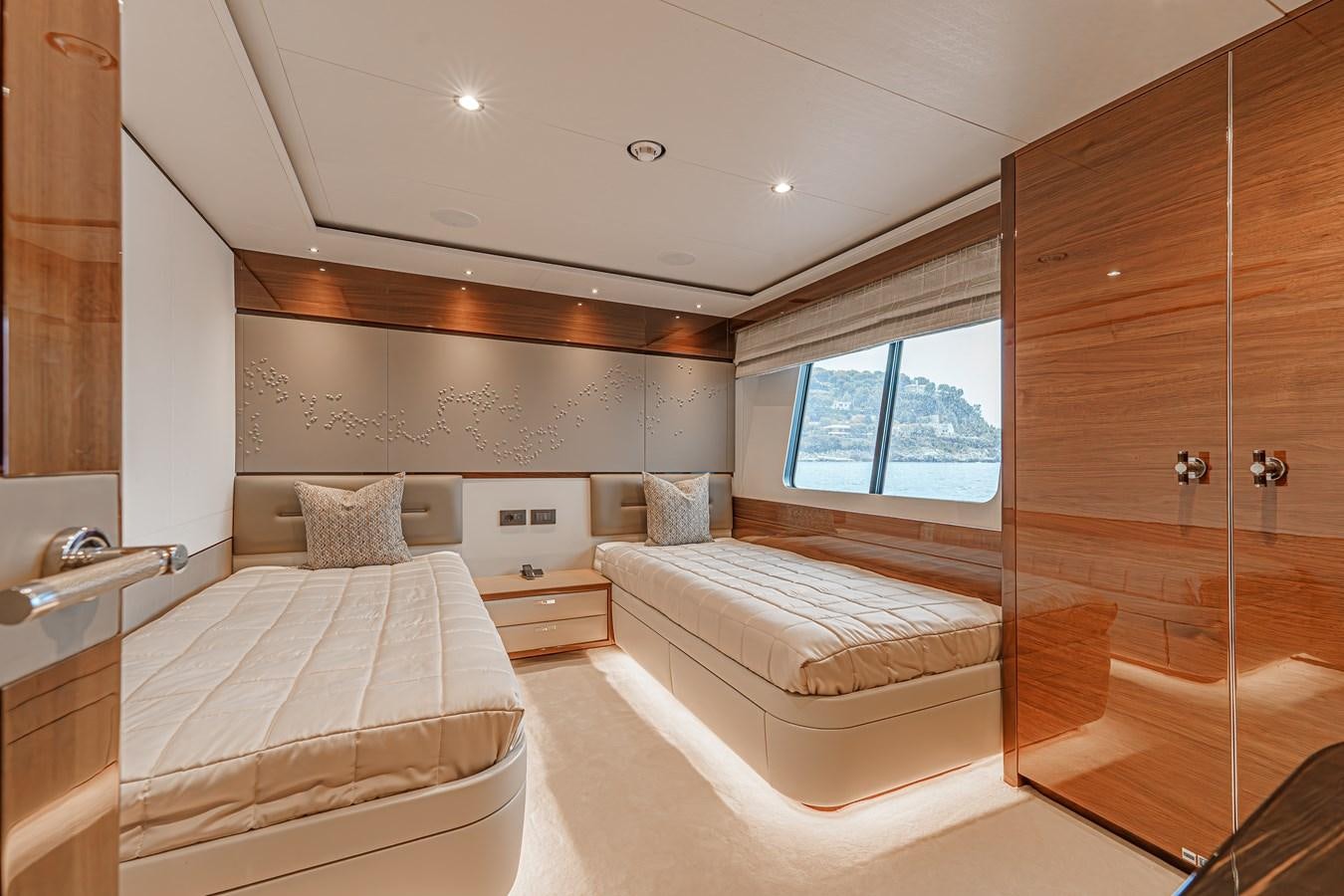 a room with a bed and a closet aboard AVALON Yacht for Sale