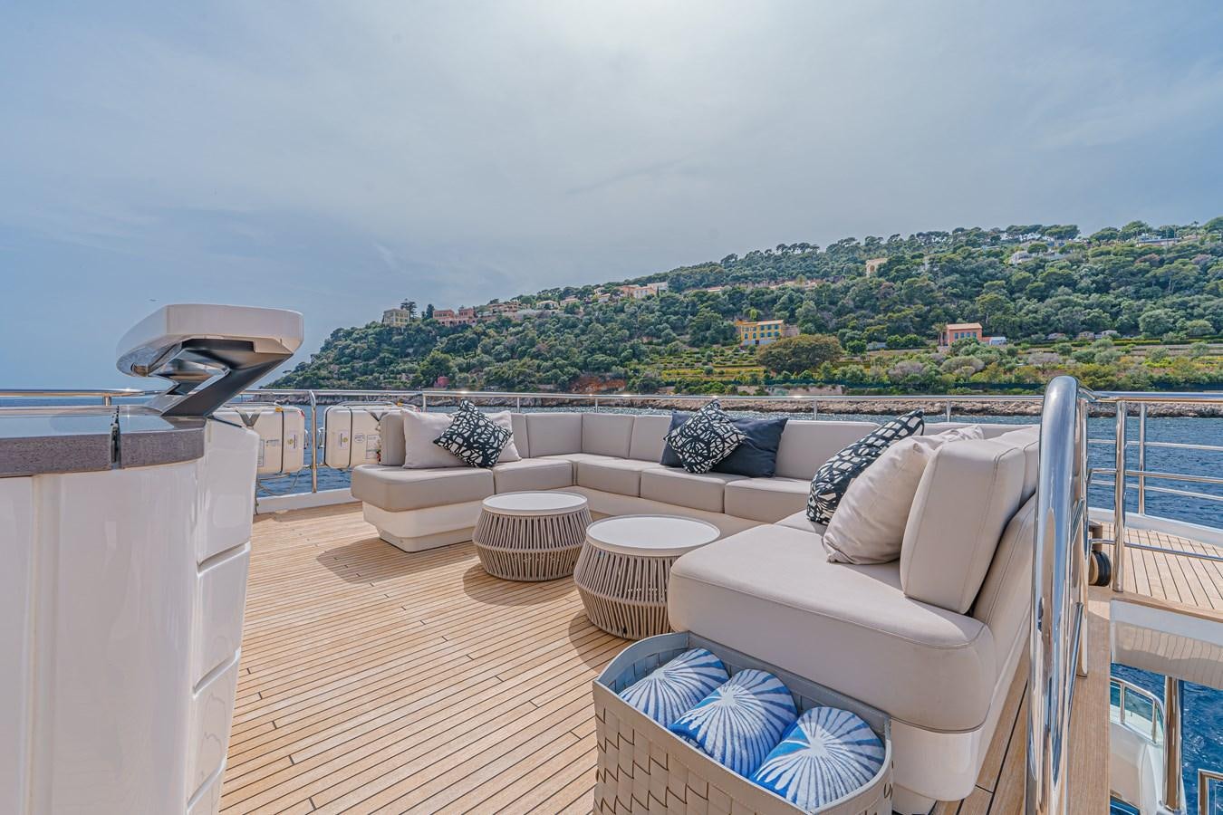 a balcony with a view of a city and mountains aboard AVALON Yacht for Sale