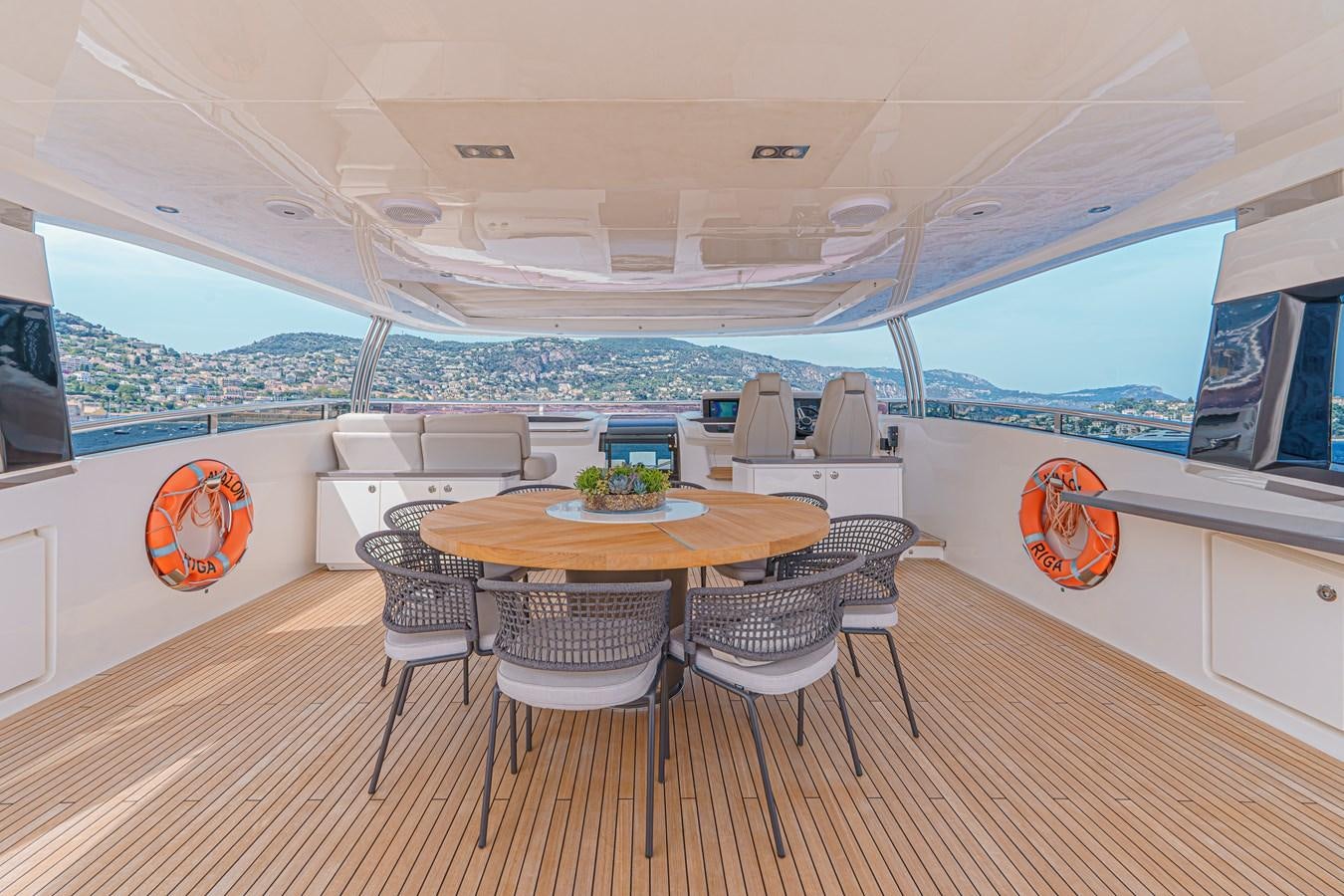a room with a table and chairs aboard AVALON Yacht for Sale