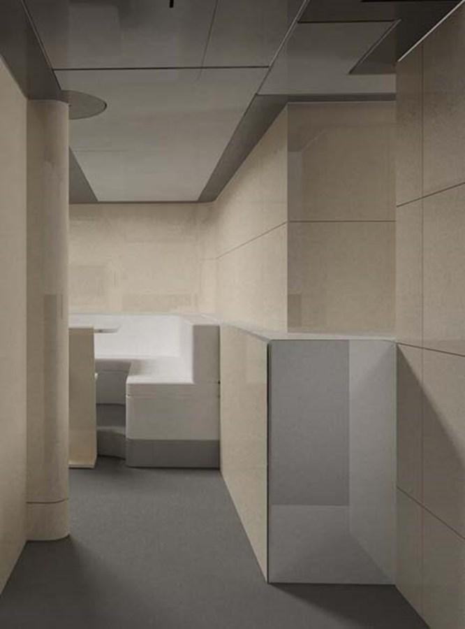 a bathroom with white tiles aboard PHEROUSA Yacht for Sale