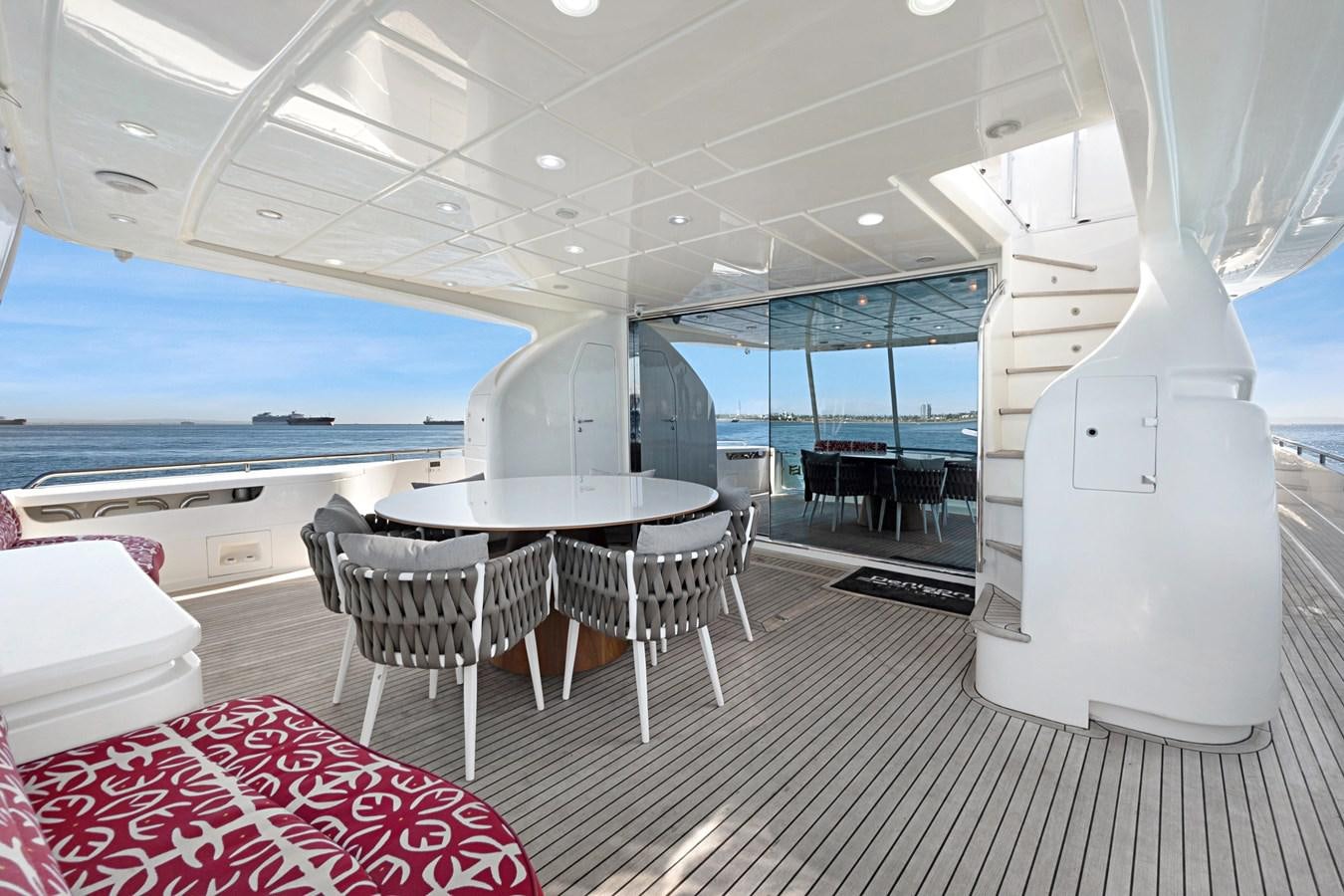 a room with a table and chairs aboard EL PAVICA Yacht for Sale