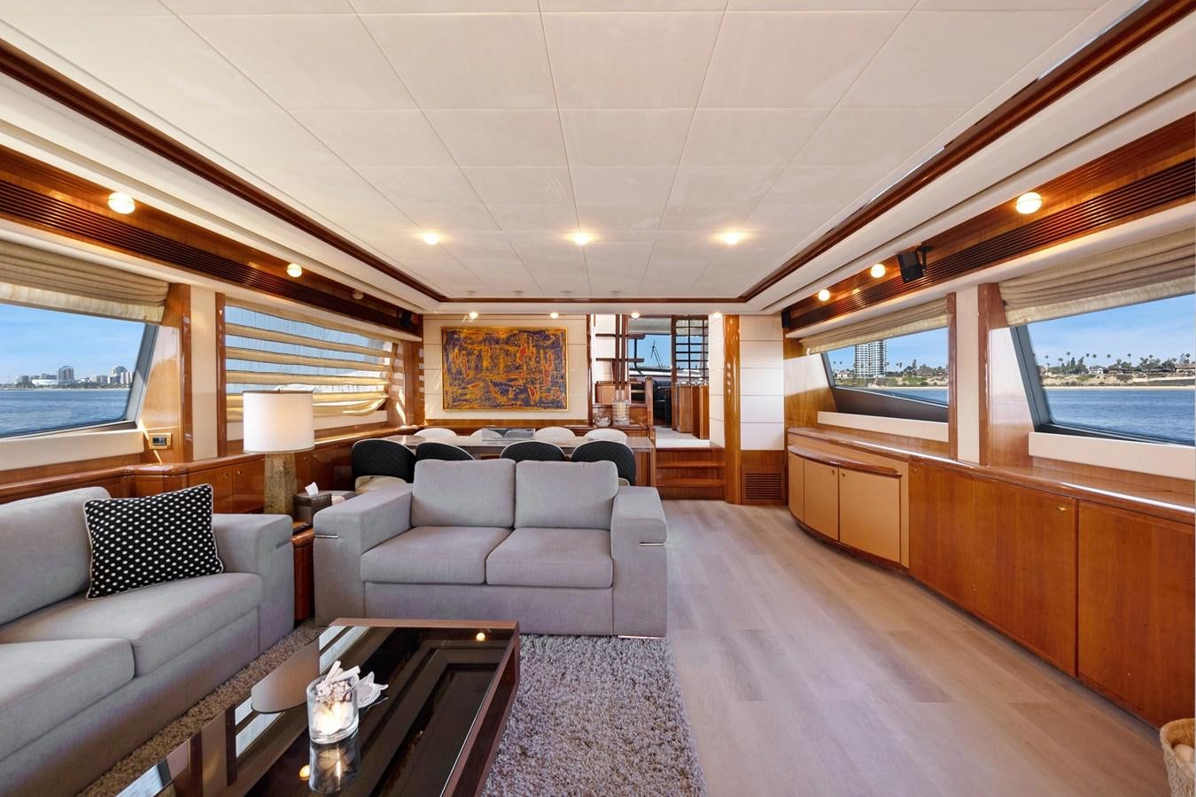 a living room with a wood floor aboard EL PAVICA Yacht for Sale