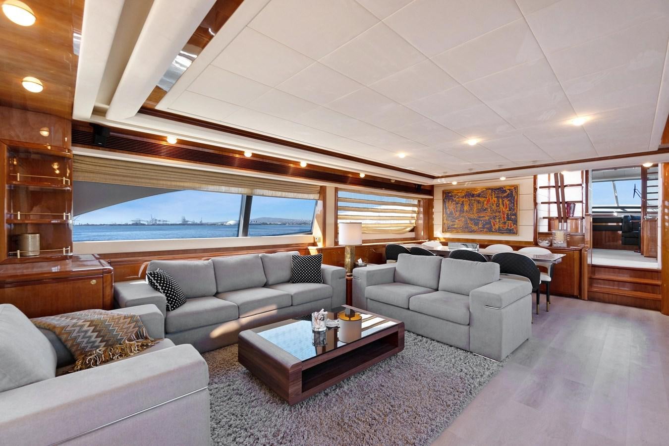a living room with a large window aboard EL PAVICA Yacht for Sale