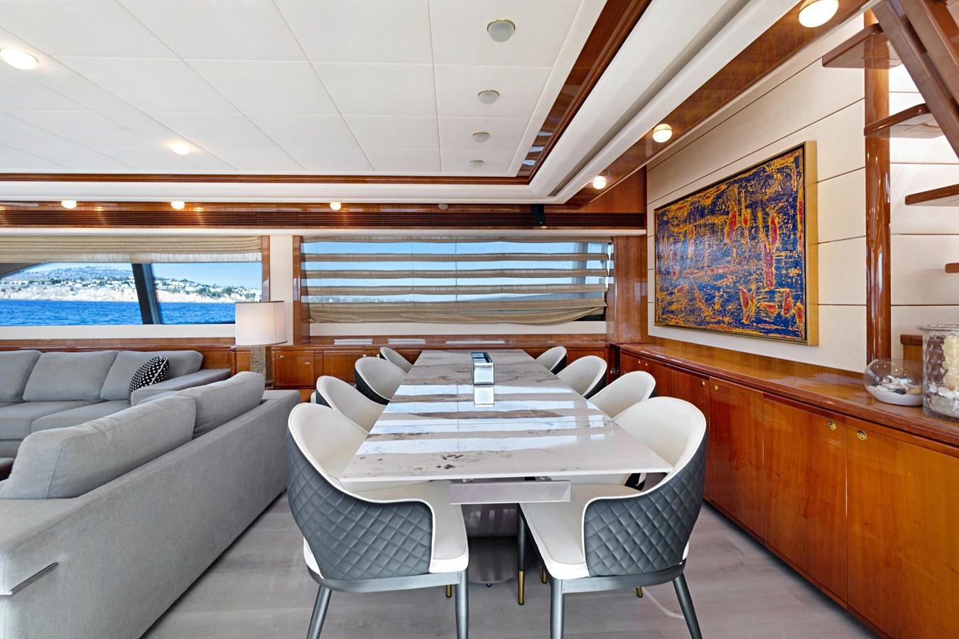 a room with a couch and a table and chairs aboard EL PAVICA Yacht for Sale