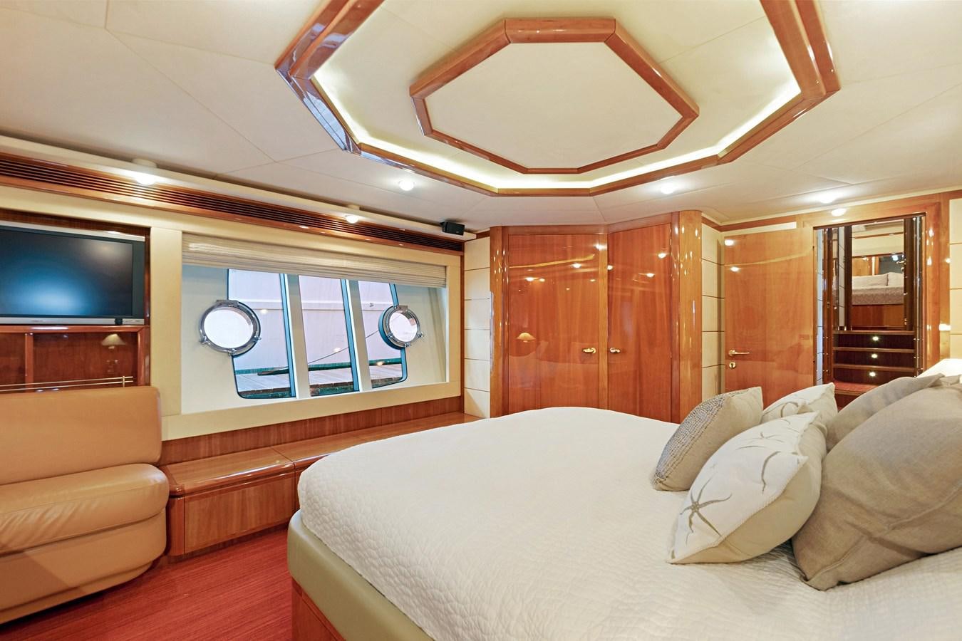 a large bedroom with a large bed aboard EL PAVICA Yacht for Sale