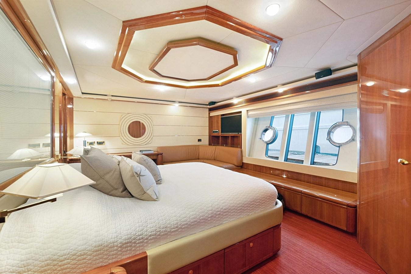 a room with a bed and a window aboard EL PAVICA Yacht for Sale