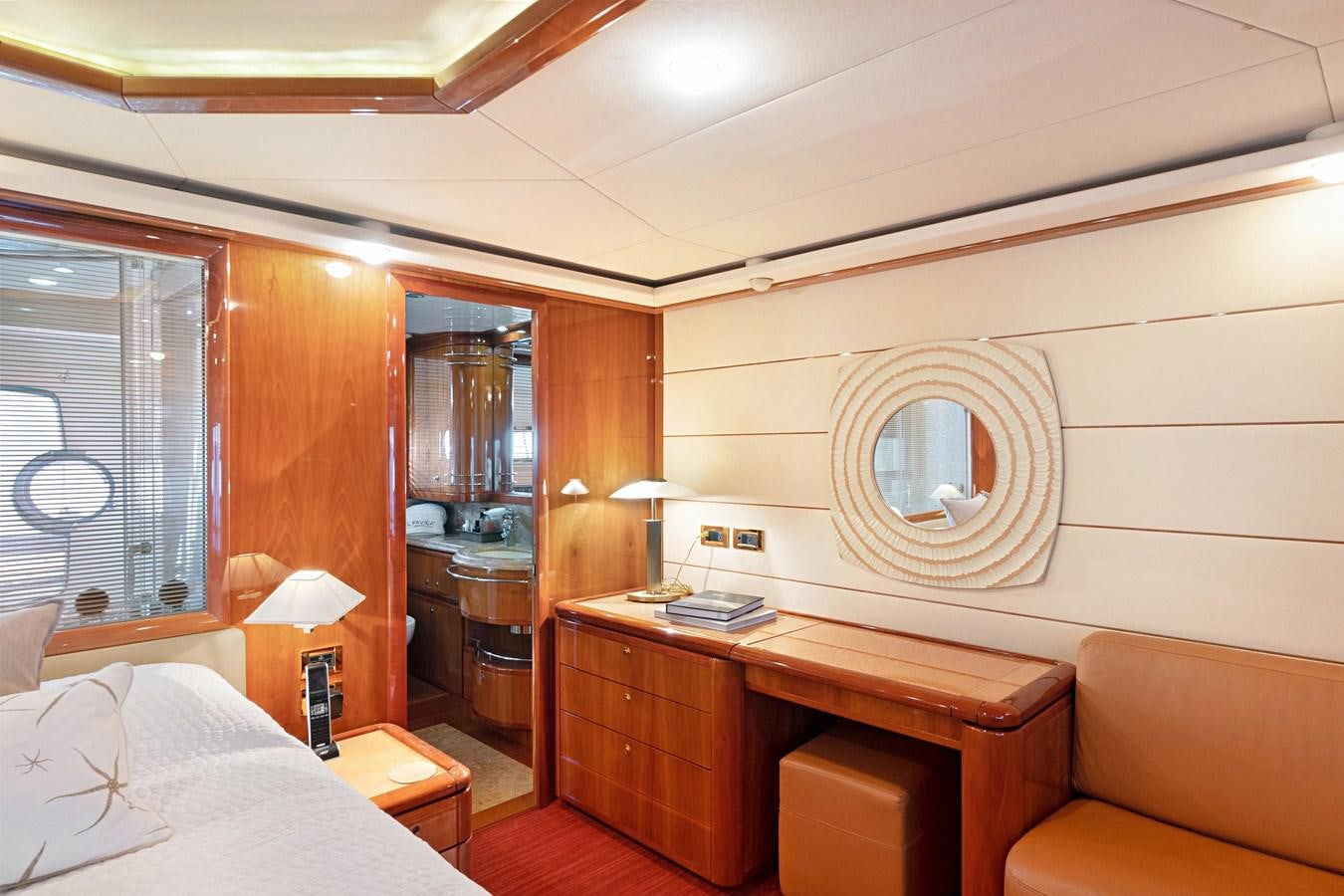 a room with a bed and a desk aboard EL PAVICA Yacht for Sale