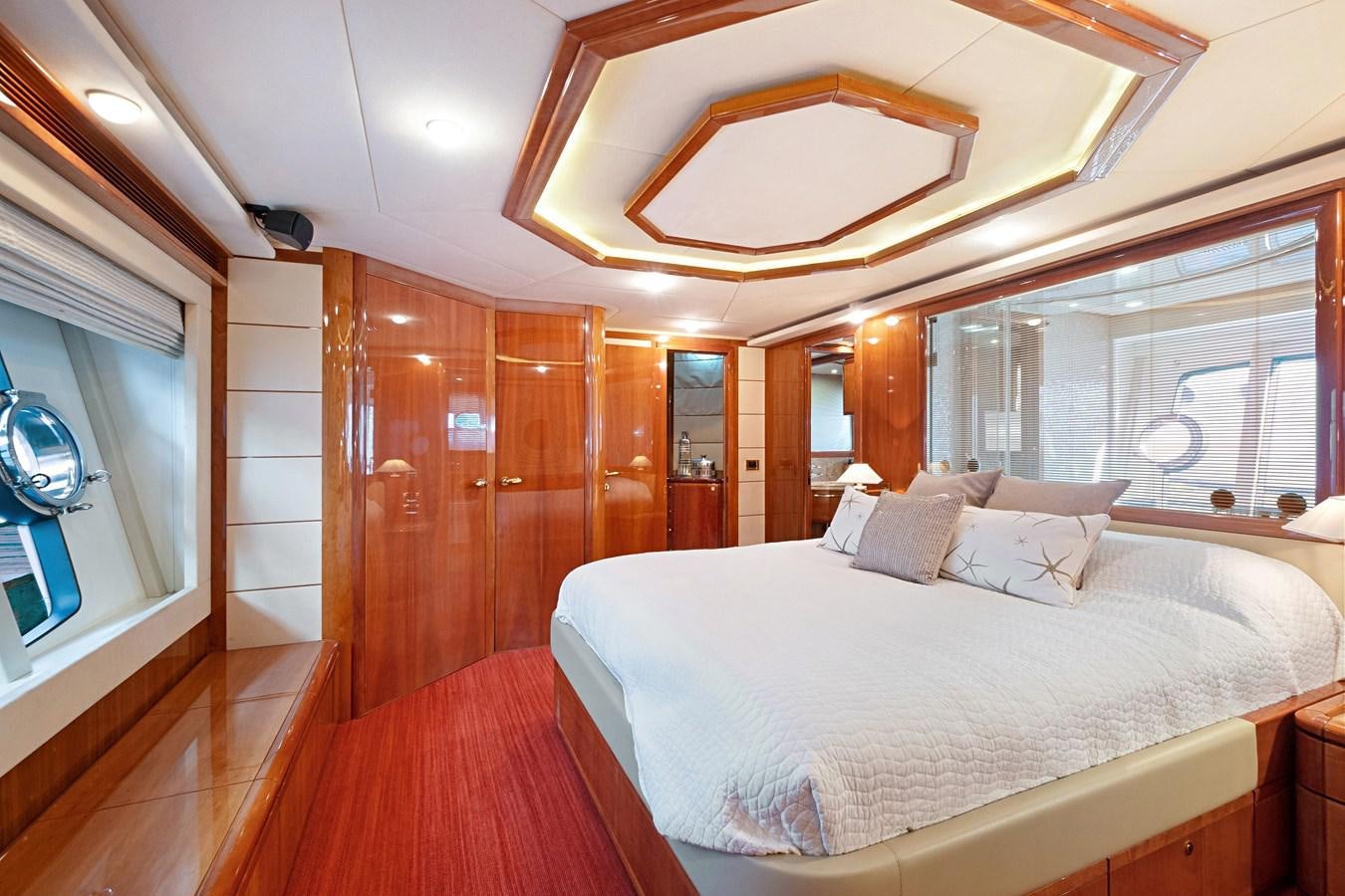 a room with a bed and a mirror aboard EL PAVICA Yacht for Sale