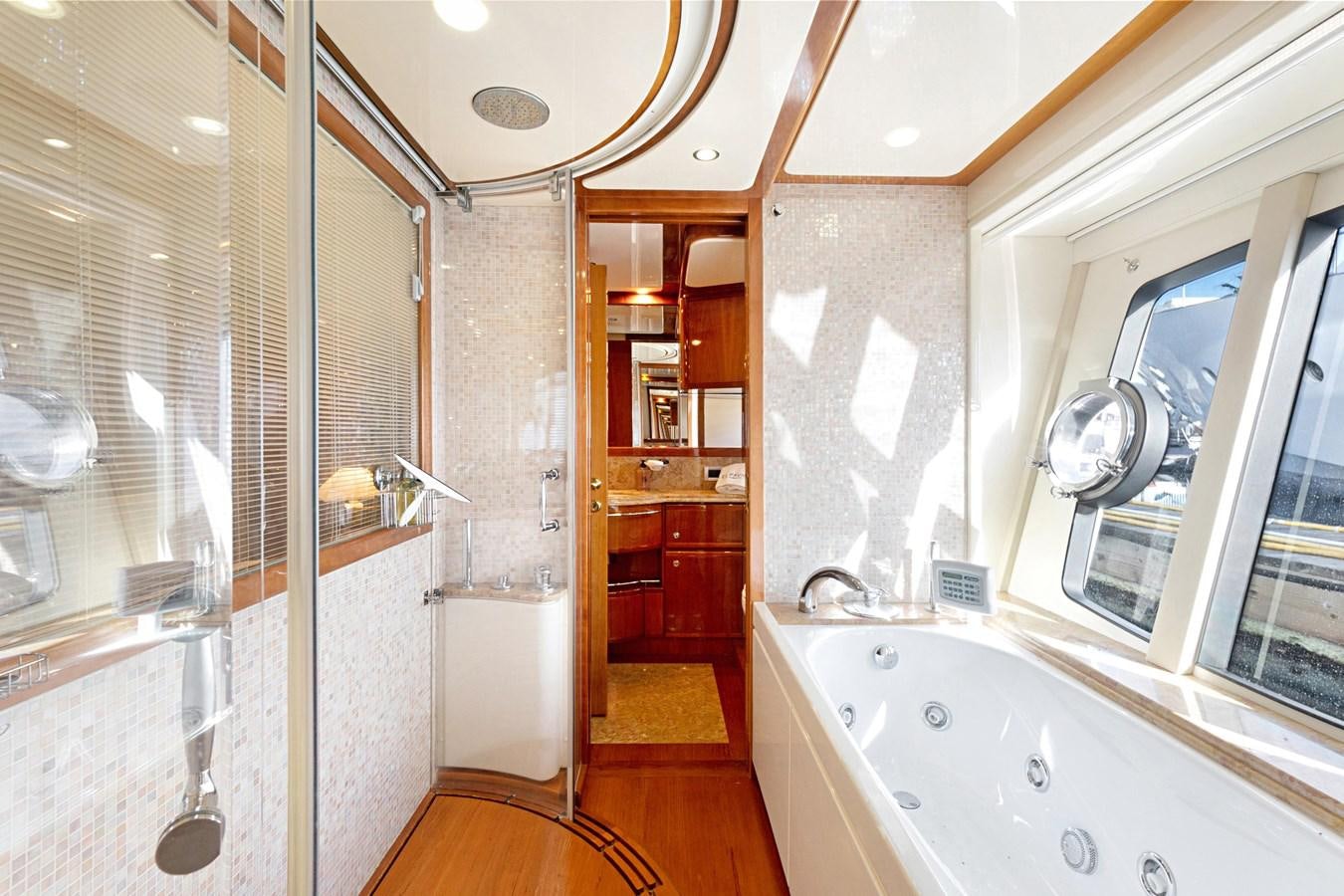 a bathroom with a bathtub and a sink aboard EL PAVICA Yacht for Sale