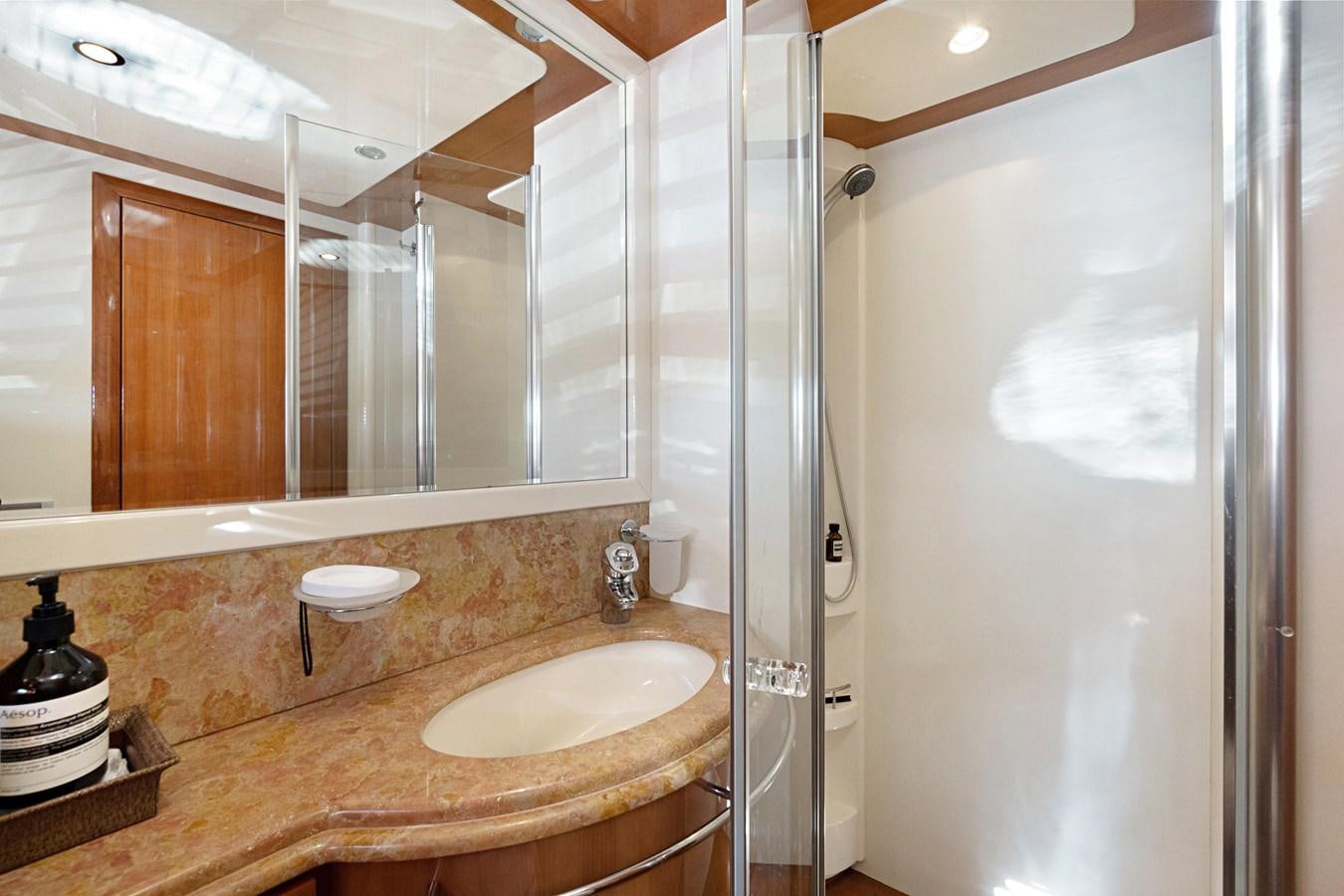 a bathroom with a large mirror aboard EL PAVICA Yacht for Sale