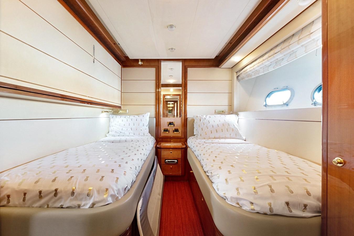 a couple of beds in a room aboard EL PAVICA Yacht for Sale