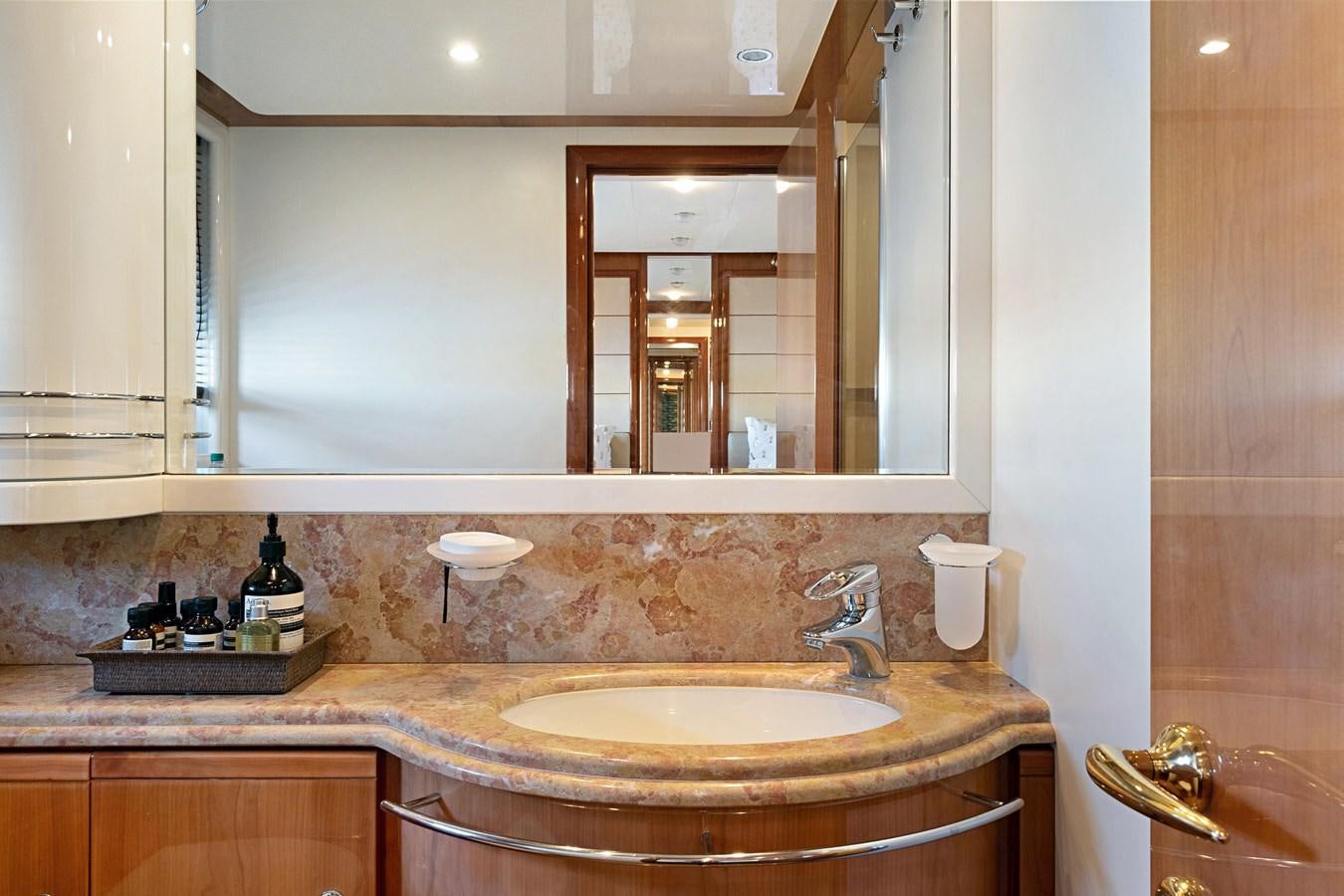 a bathroom with a large mirror aboard EL PAVICA Yacht for Sale