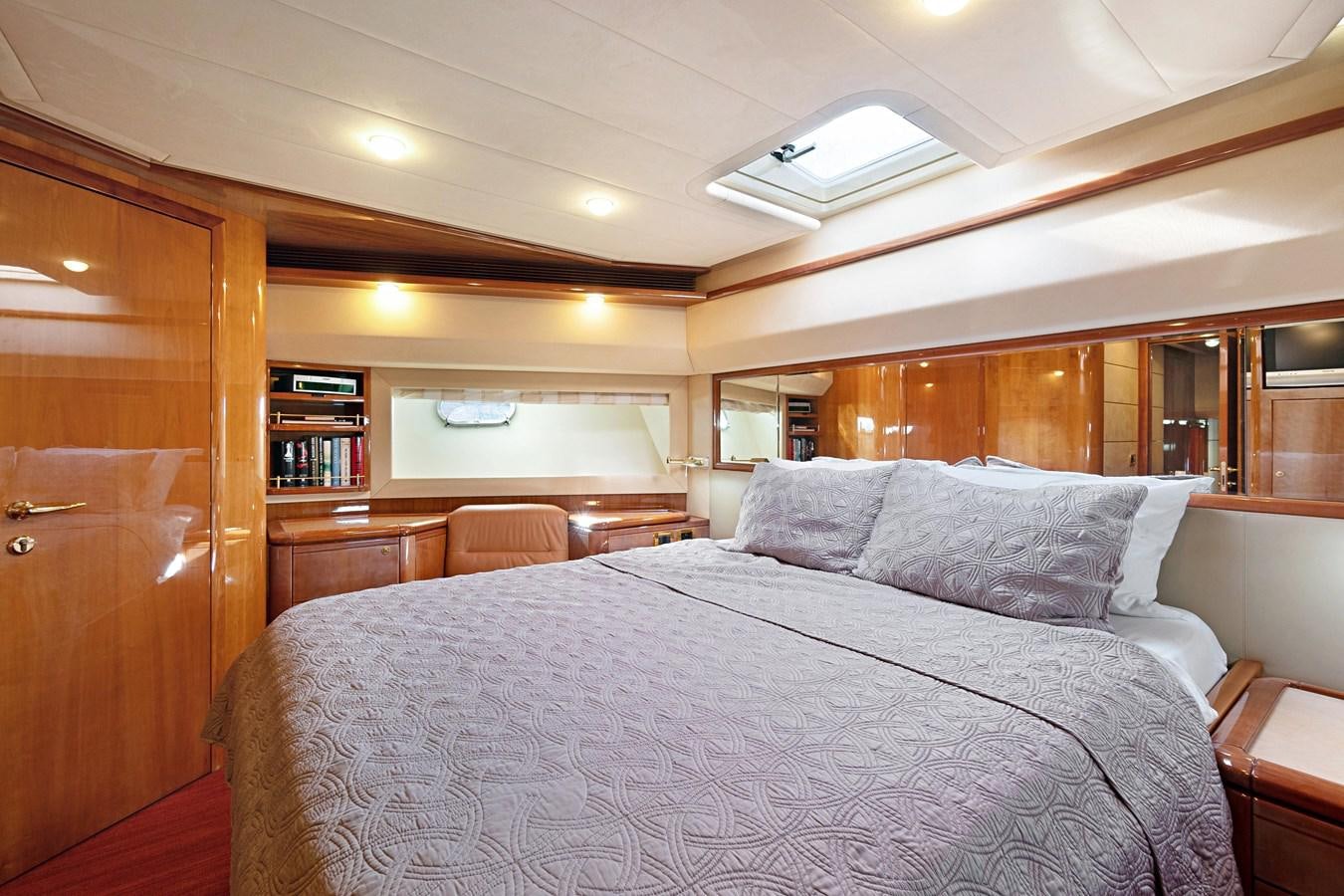 a bed in a room aboard EL PAVICA Yacht for Sale