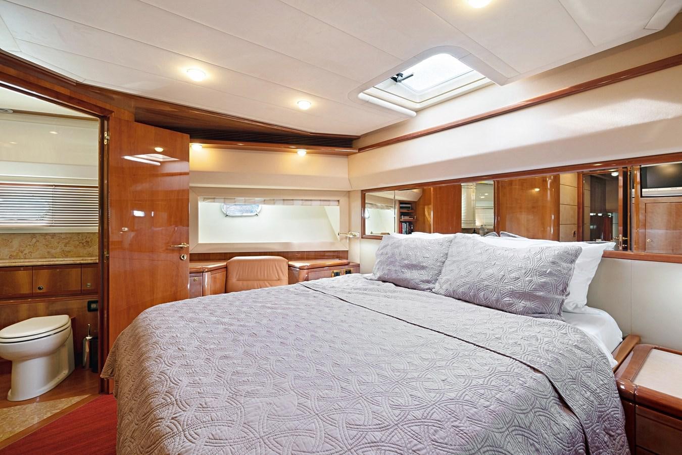 a large bed in a room aboard EL PAVICA Yacht for Sale