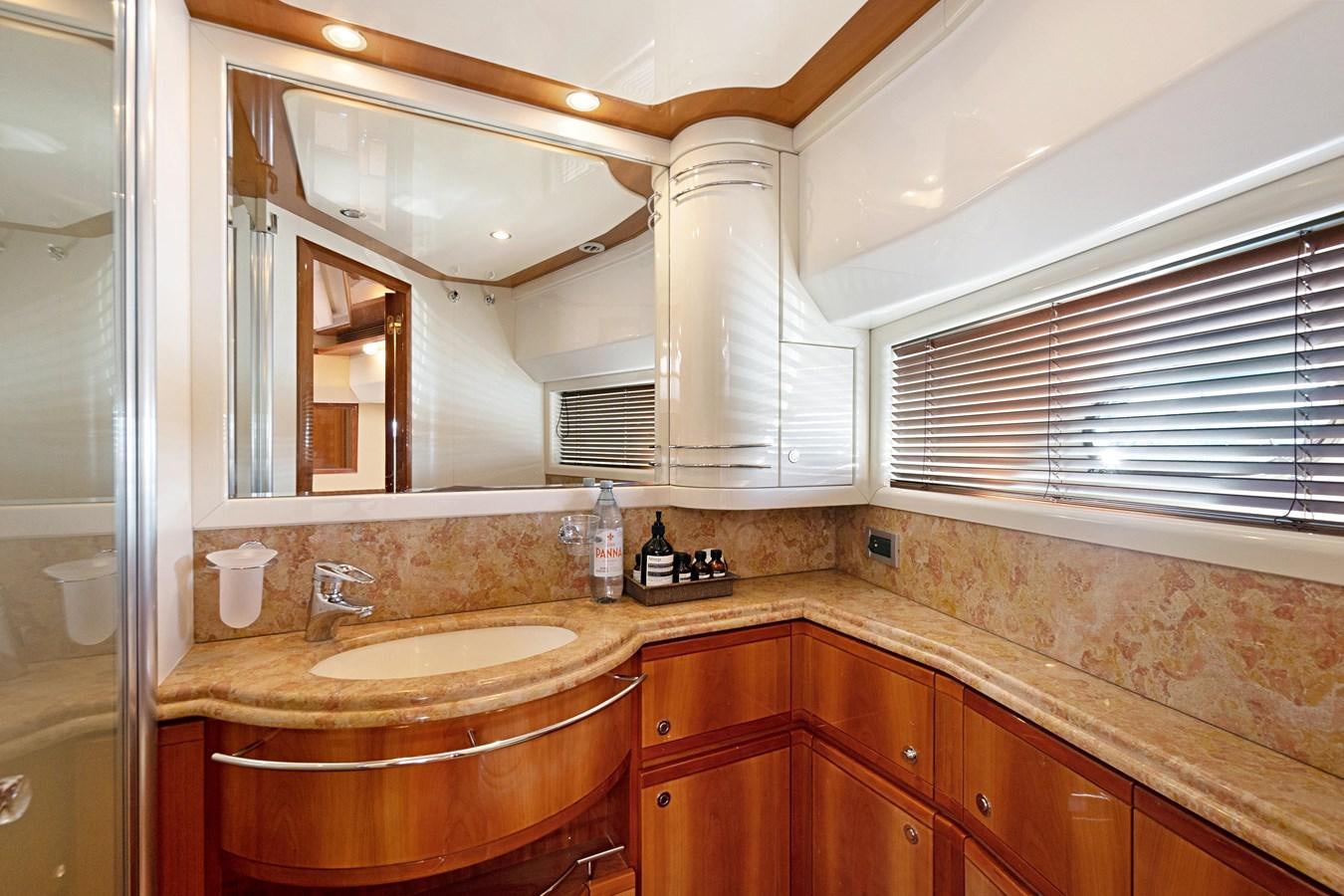 a bathroom with a sink and a mirror aboard EL PAVICA Yacht for Sale