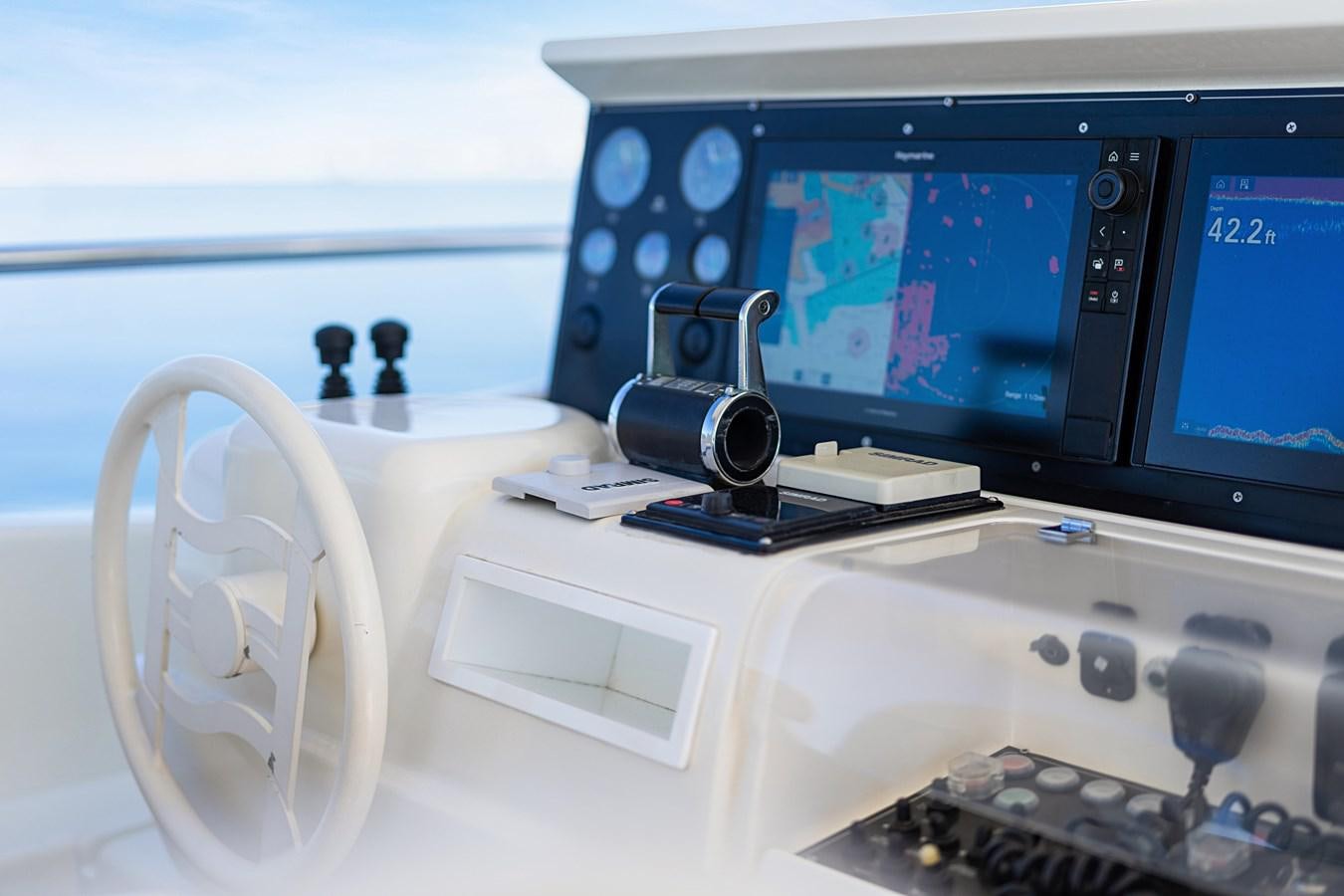 a computer with a screen and speakers aboard EL PAVICA Yacht for Sale