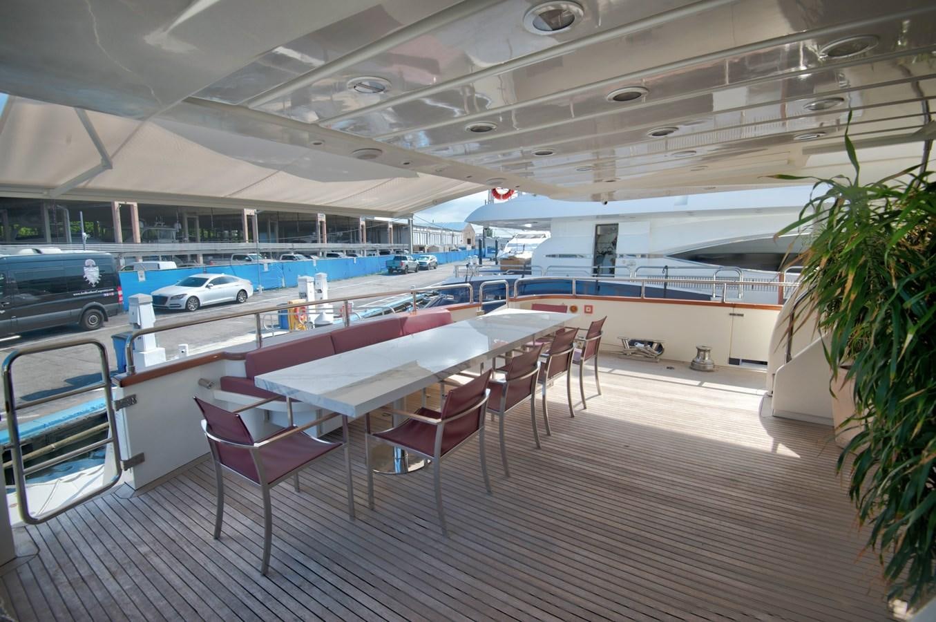 a table and chairs in a room aboard LUISAMAY Yacht for Sale