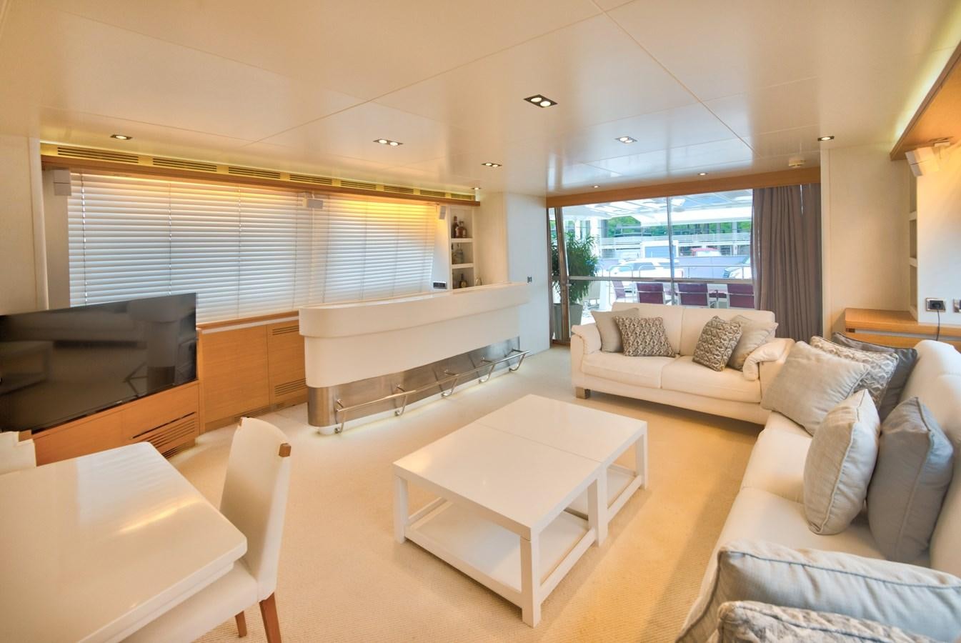 a living room with a large window aboard LUISAMAY Yacht for Sale