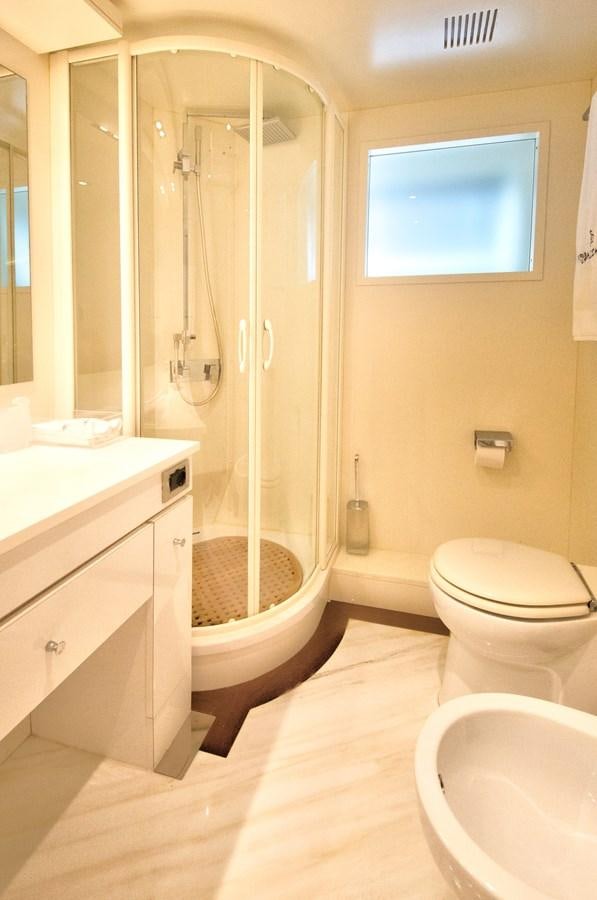 a bathroom with a shower and a toilet aboard LUISAMAY Yacht for Sale