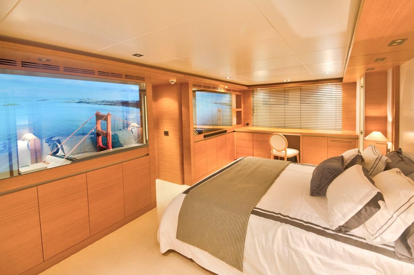 a room with a bed and a tv aboard LUISAMAY Yacht for Sale