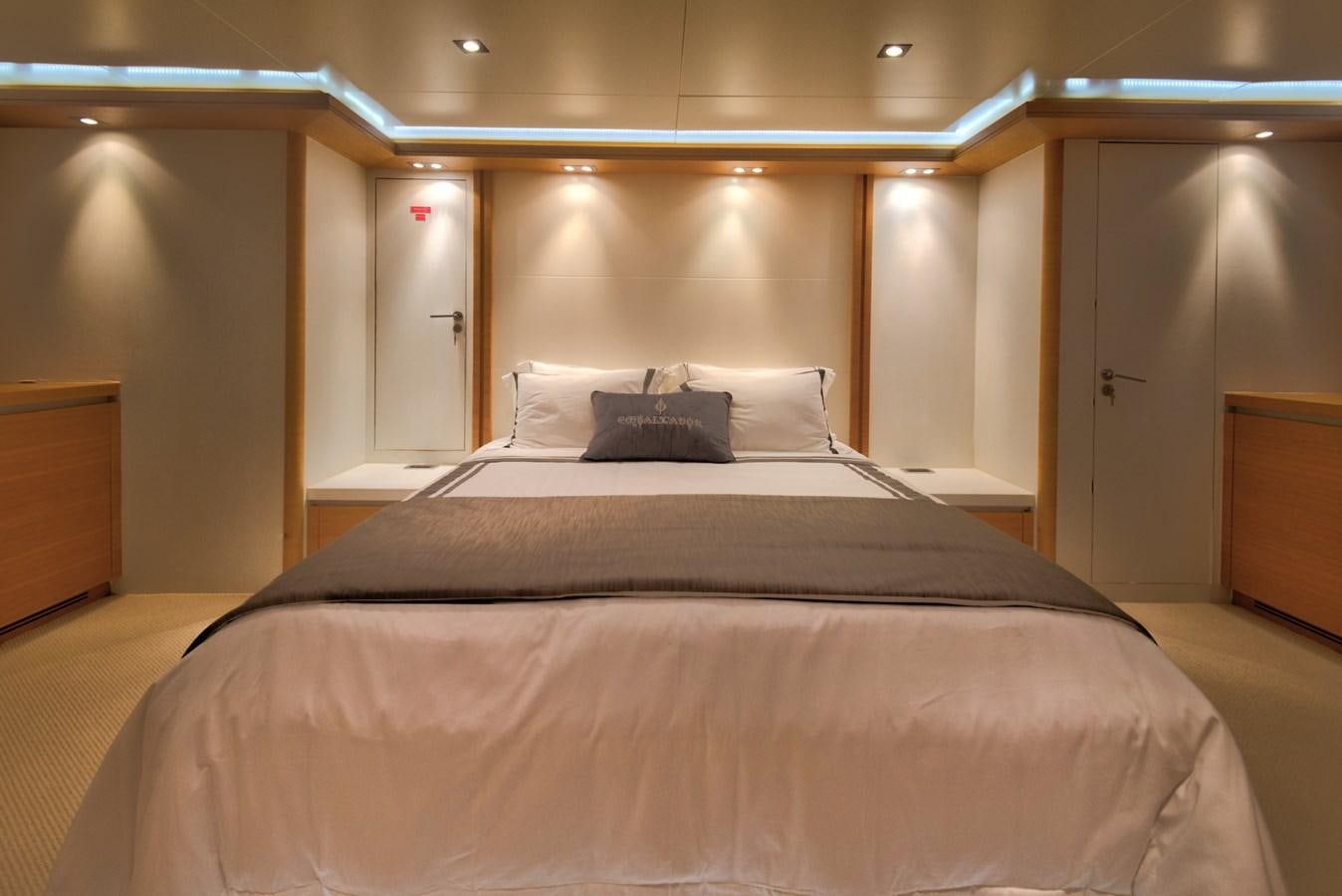 a bed with a black comforter aboard LUISAMAY Yacht for Sale