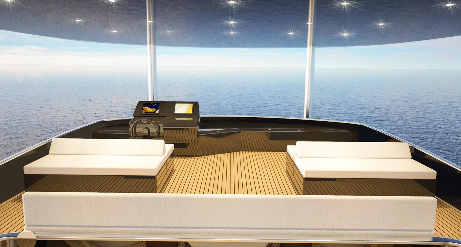 a desk with a computer and books on it aboard CUSTOM Yacht for Sale