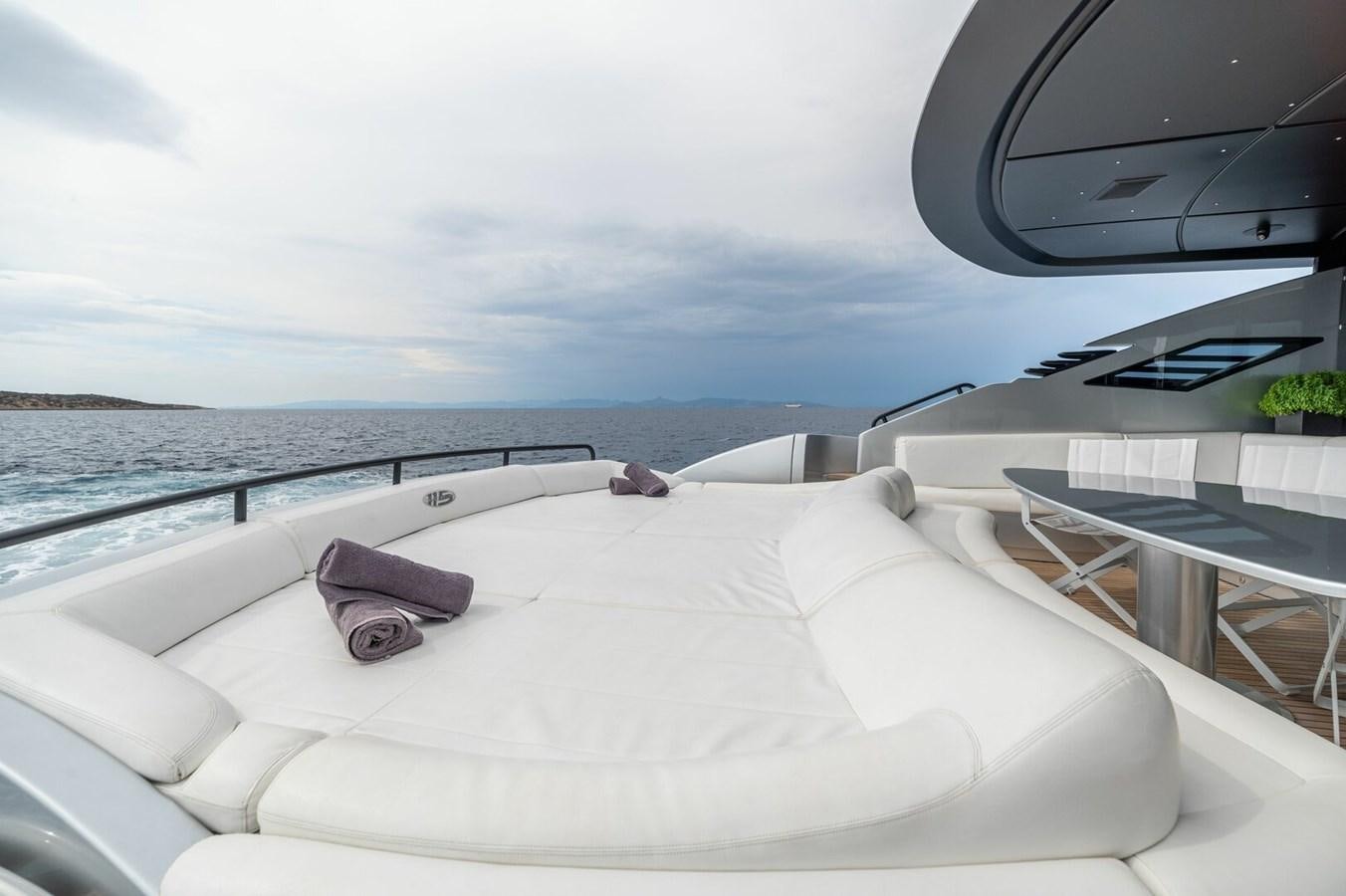a white bed on a boat aboard REBOOT Yacht for Sale