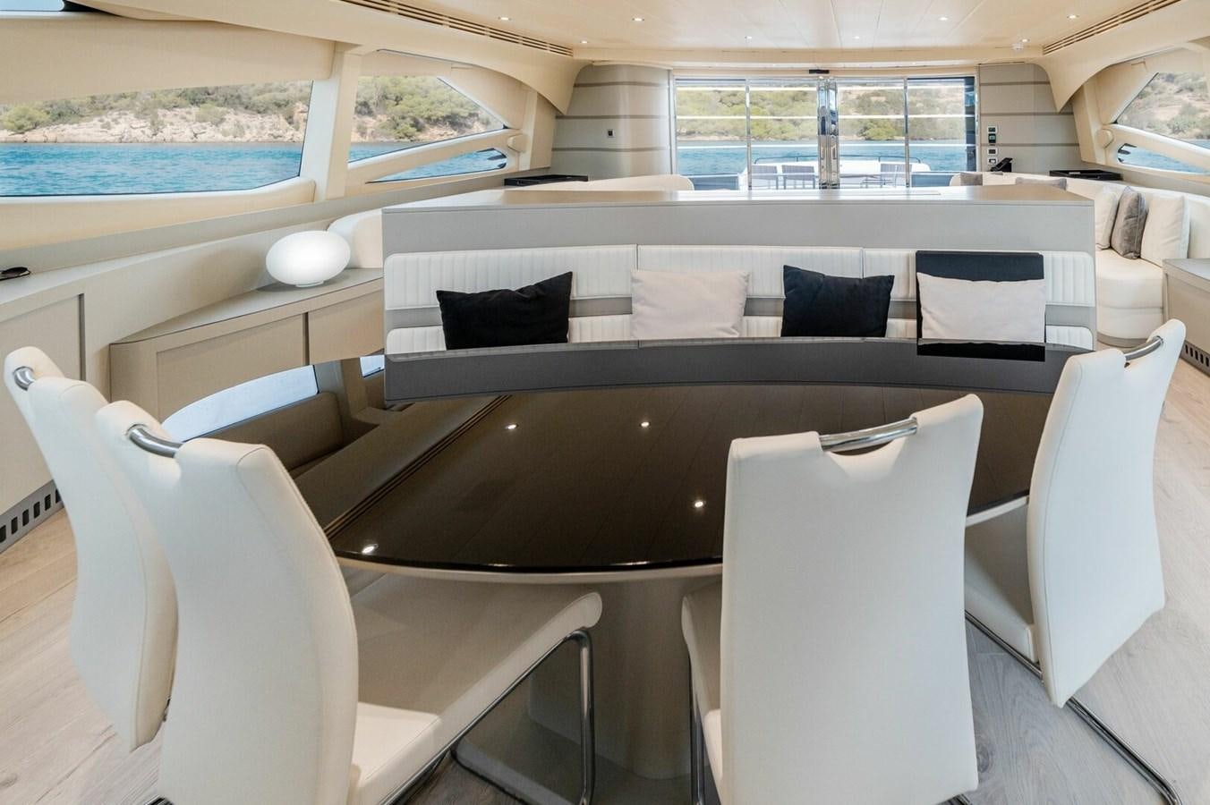 a room with a couch and chairs aboard REBOOT Yacht for Sale
