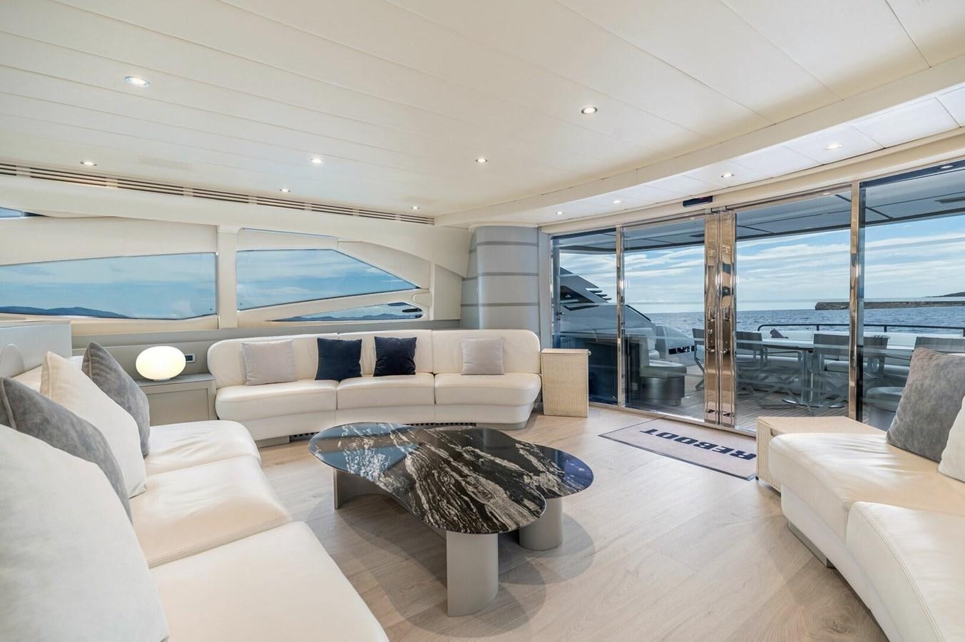 a living room with a large glass window aboard REBOOT Yacht for Sale