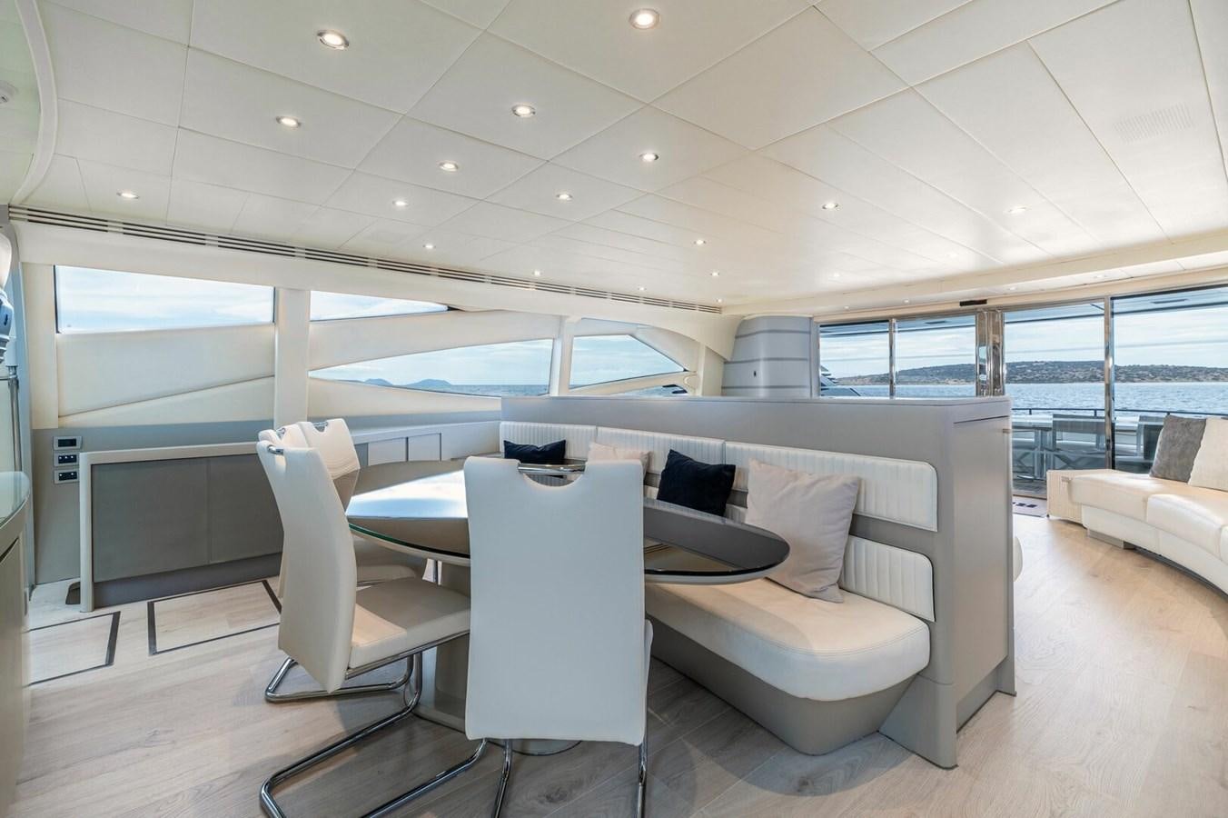 a living room with a couch and a table aboard REBOOT Yacht for Sale