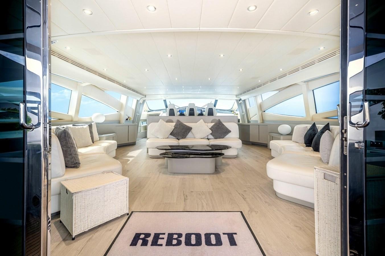 a living room with a couch and a rug aboard REBOOT Yacht for Sale