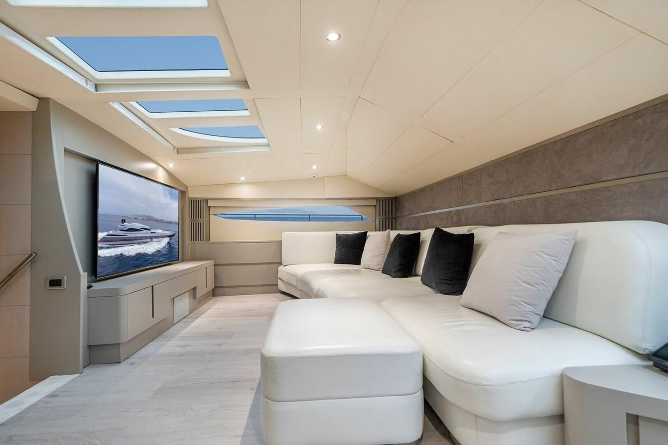 a room with a bed and a tv aboard REBOOT Yacht for Sale