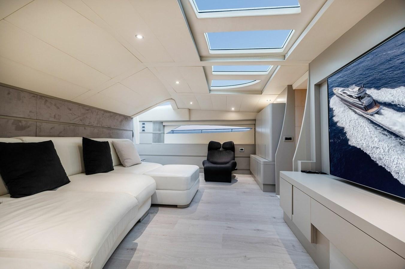 a room with a bed and a couch aboard REBOOT Yacht for Sale