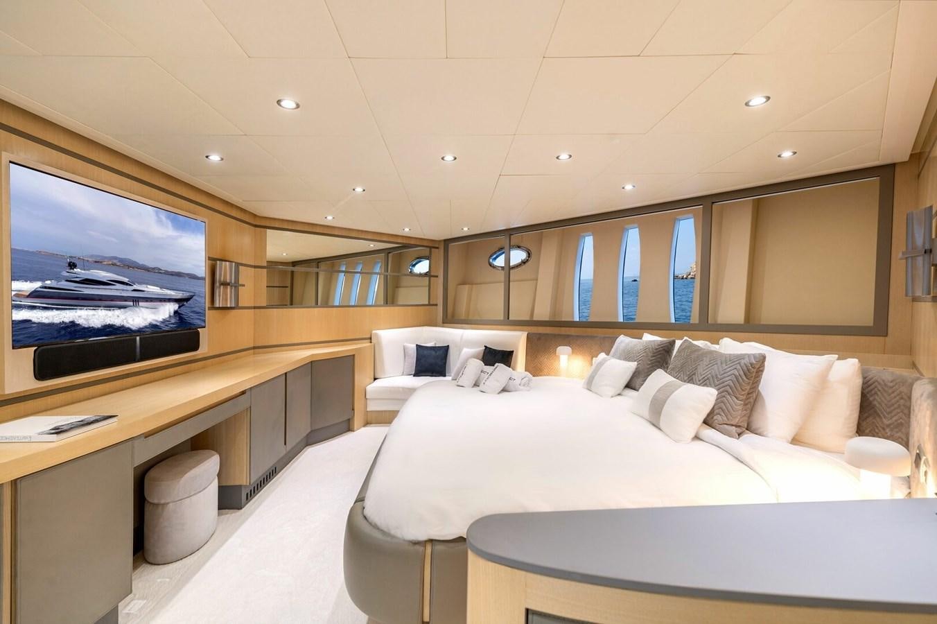 a room with a bed and a tv aboard REBOOT Yacht for Sale
