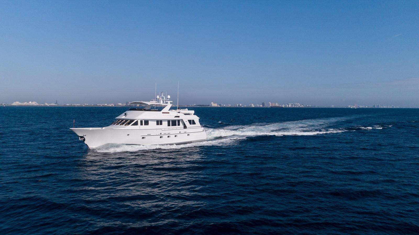 a white boat in the water aboard WELL DONE Yacht for Sale