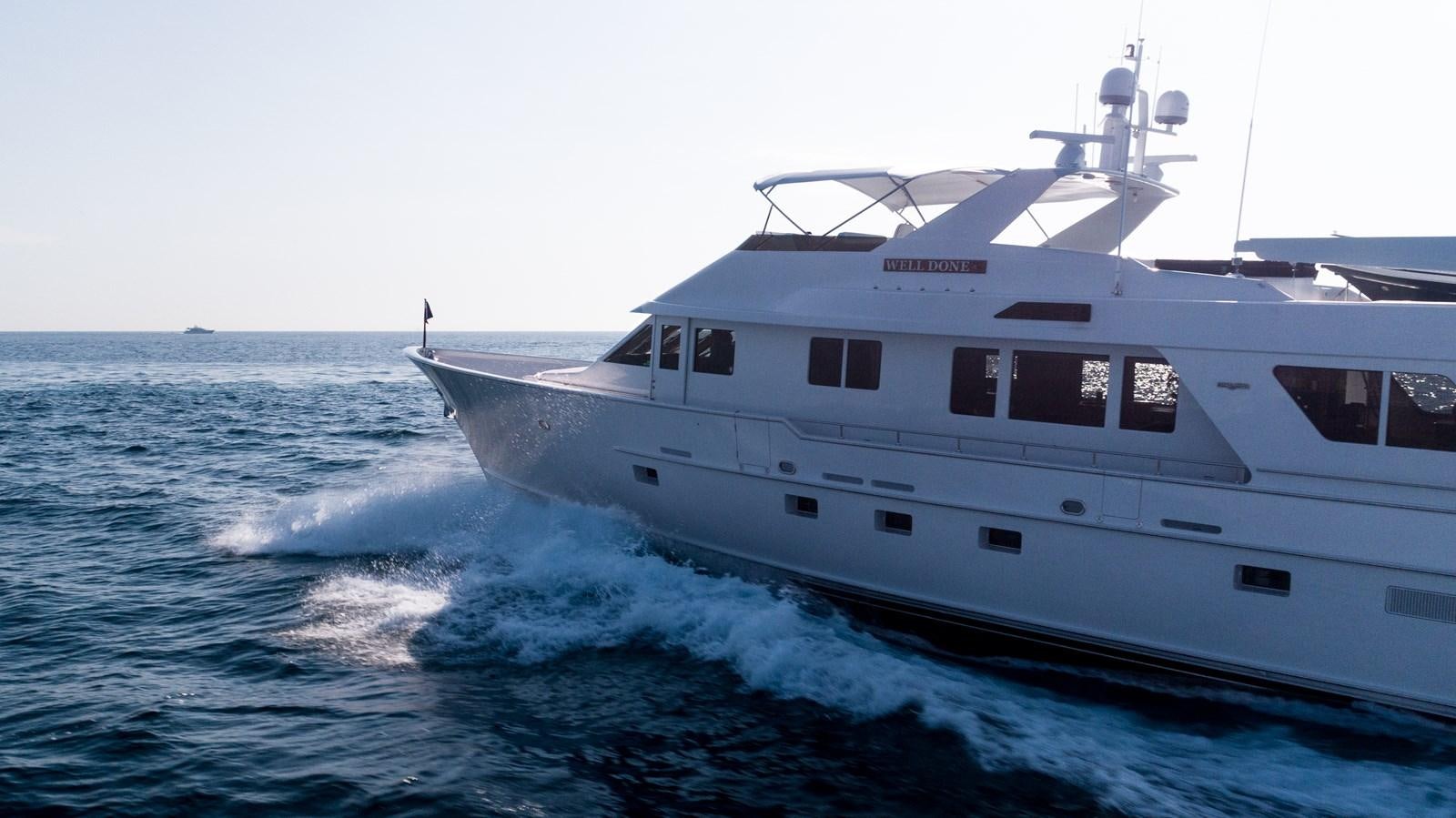 a white boat on the water aboard WELL DONE Yacht for Sale
