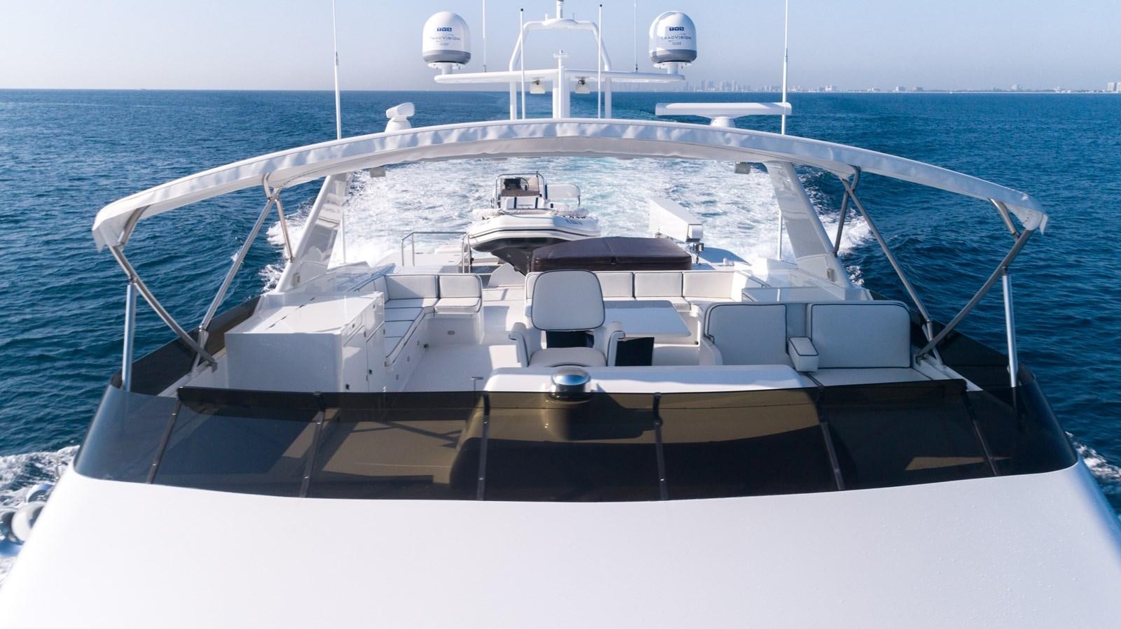 a white boat on the water aboard WELL DONE Yacht for Sale