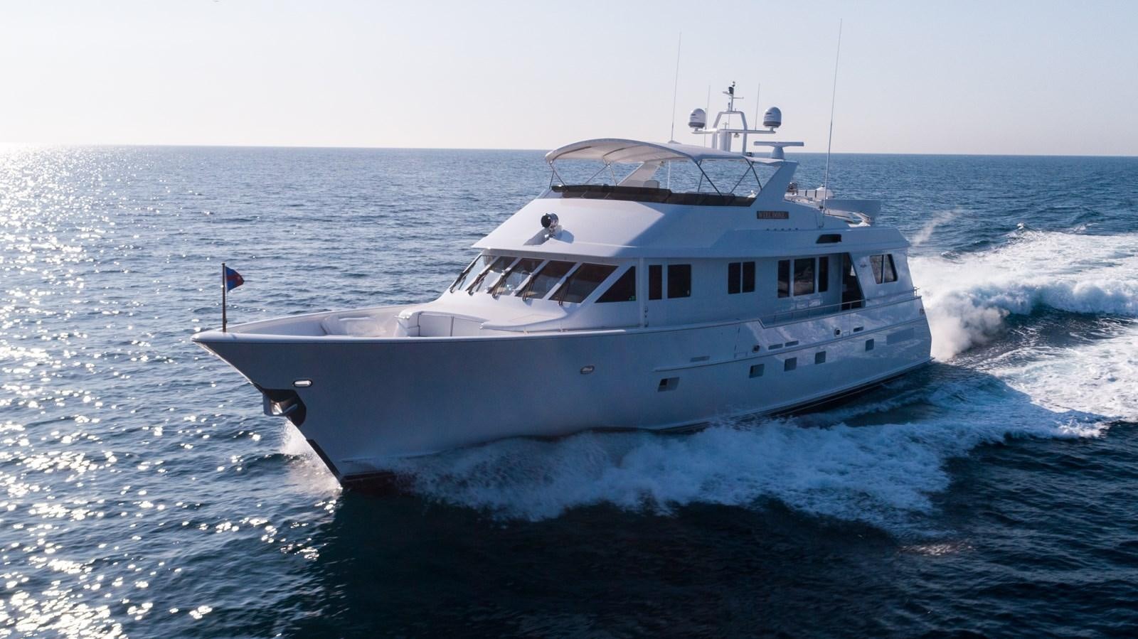 a white boat on the water aboard WELL DONE Yacht for Sale