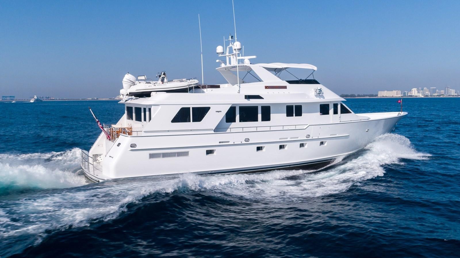 a large white boat aboard WELL DONE Yacht for Sale